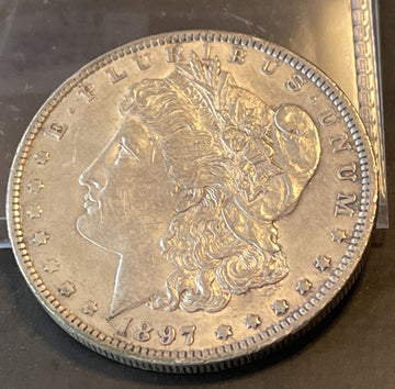 Scarce 1897 o Uncirculated Det $ tiny scratches & dings real winner, collectible
