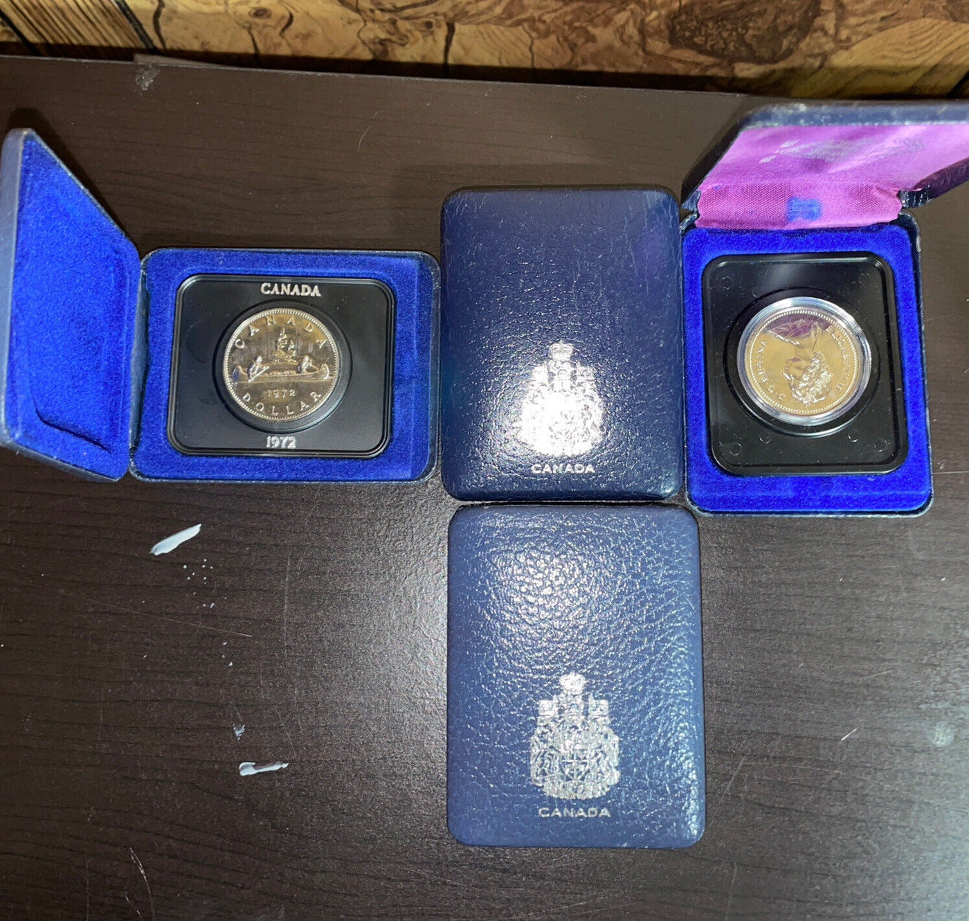 Lot of 4 different silvercolor nickel loonies proof in box OGP 1 bid per lot