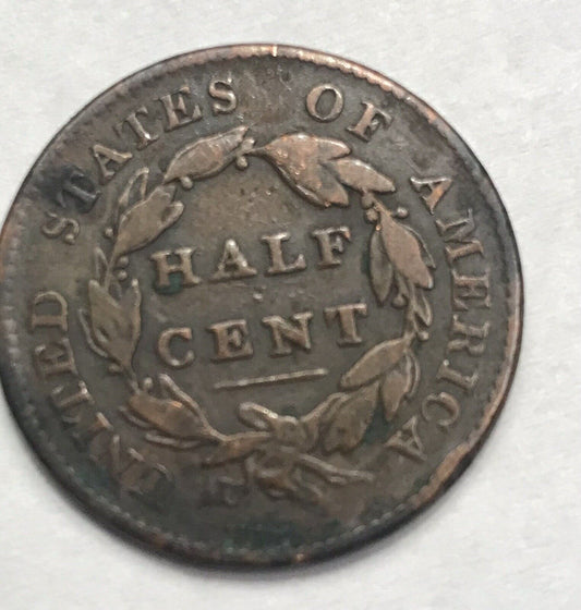 1825 classic head half cent fine circulated coin flanked by stars value￼