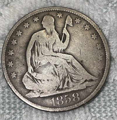 1858 o seated liberty silver half $ nice rims VG cond. these scarcer daily!