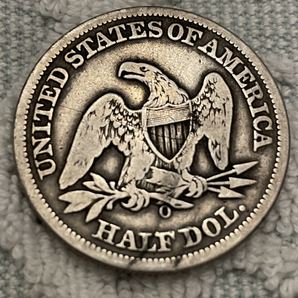 1858 o seated liberty silver half $ nice rims VG cond. these scarcer daily!